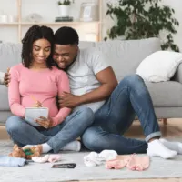 Expecting mom and dad writing a list to get ready for baby