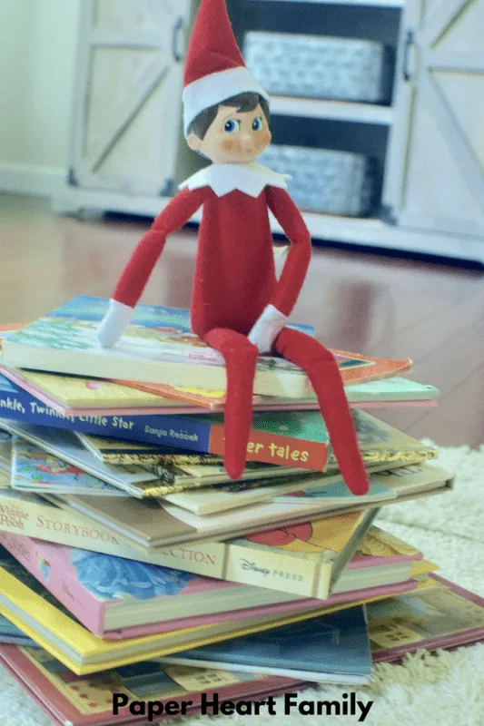 Pose your elf on the shelf with a tree made out of books!