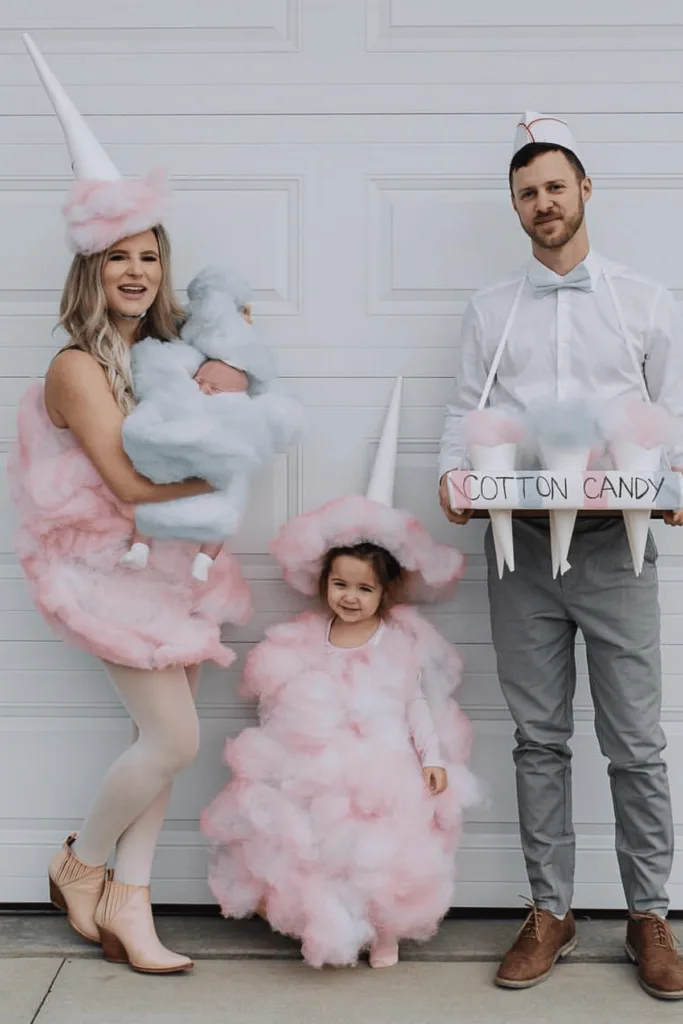 Dad as cotton candy vendor and mom and baby as cotton candy