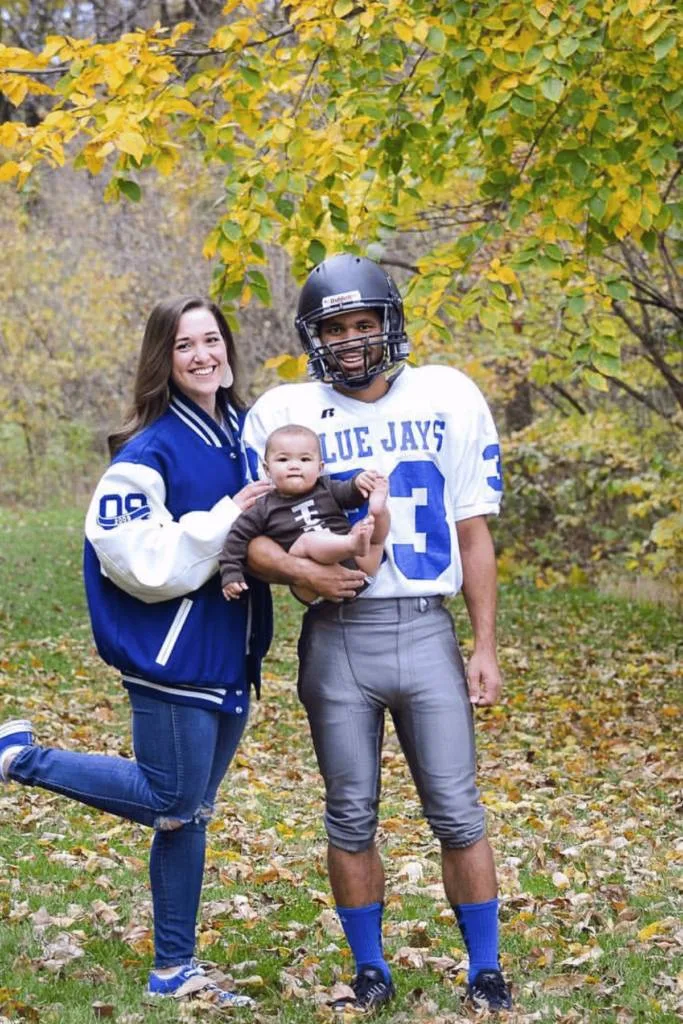 Dad as a football player, mom as a fan and baby as a football