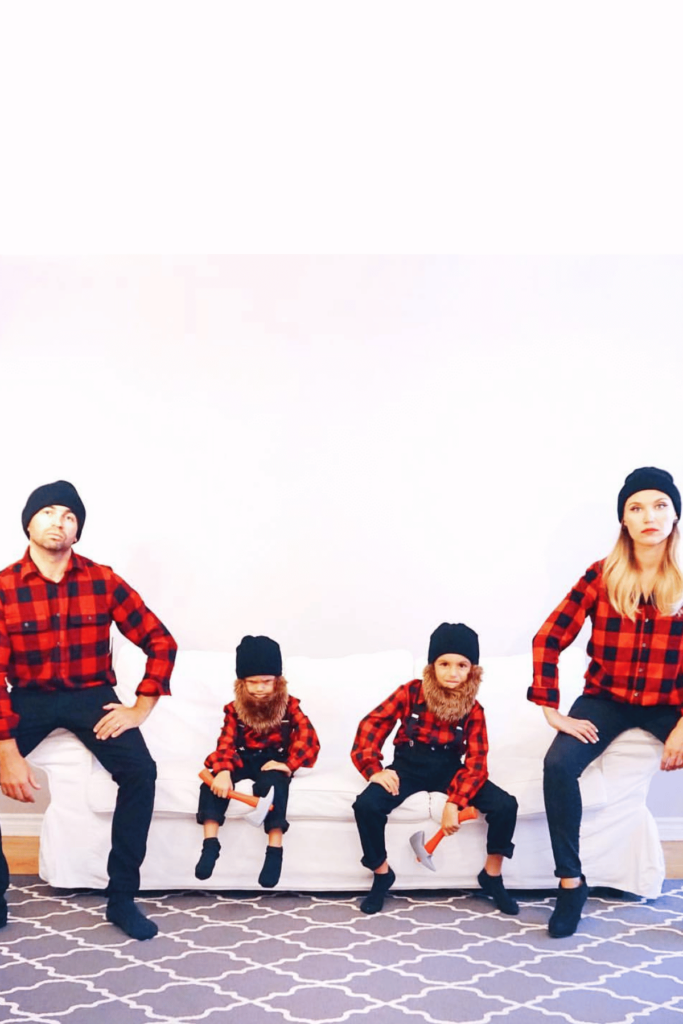 All four wearing red and black flannel, black pants, fake beards for the boys and everyone holding axes