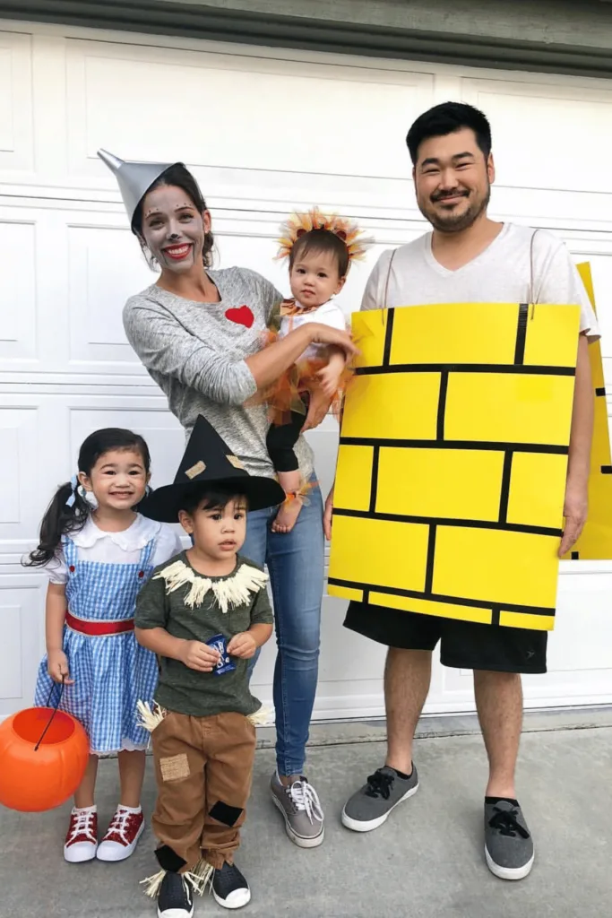 Mom as the Tin Man, dad as the yellow brick road, girl as Dorothy, boy as scarecrow and baby as lion.