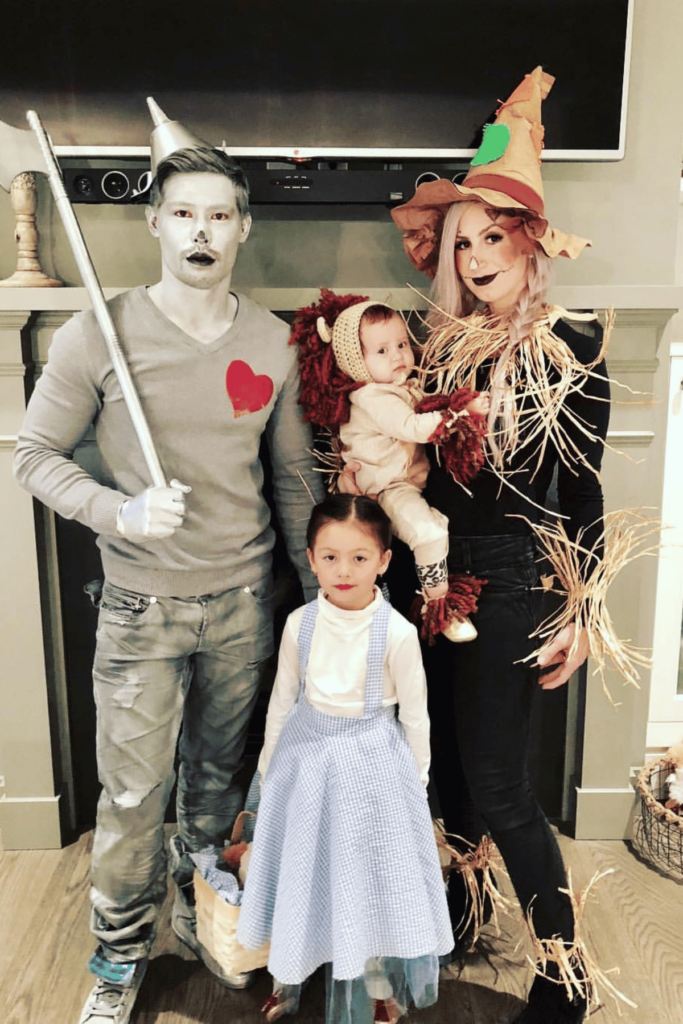 Mom as scarecrow, dad as tin man, little girl as Dorothy and baby as a lion