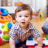 Boy playing on the floor