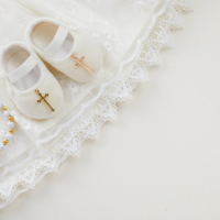 Baby booties with gold cross detail