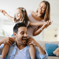 Little girl playing with her mom and dad