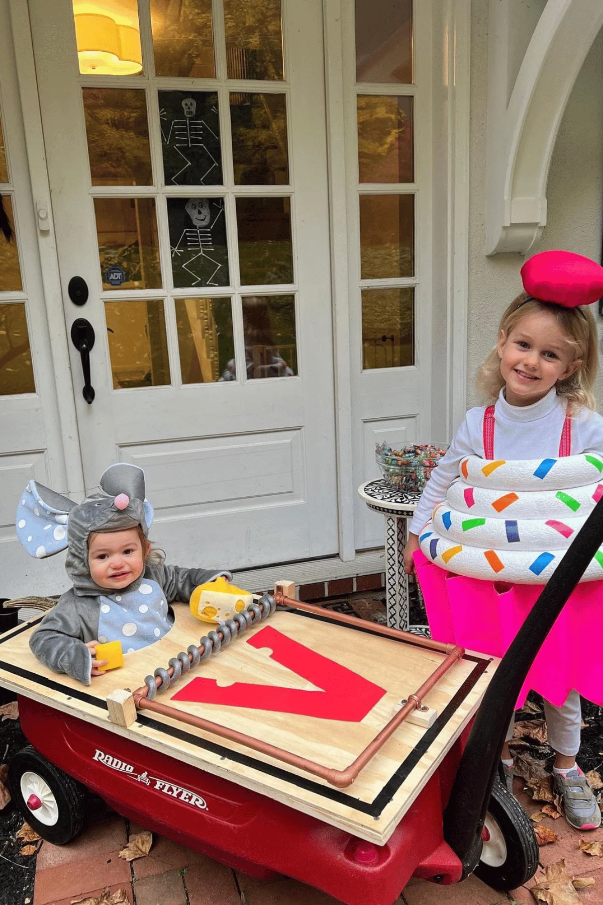 Baby dressed as a mouse in a mouse trap wagon