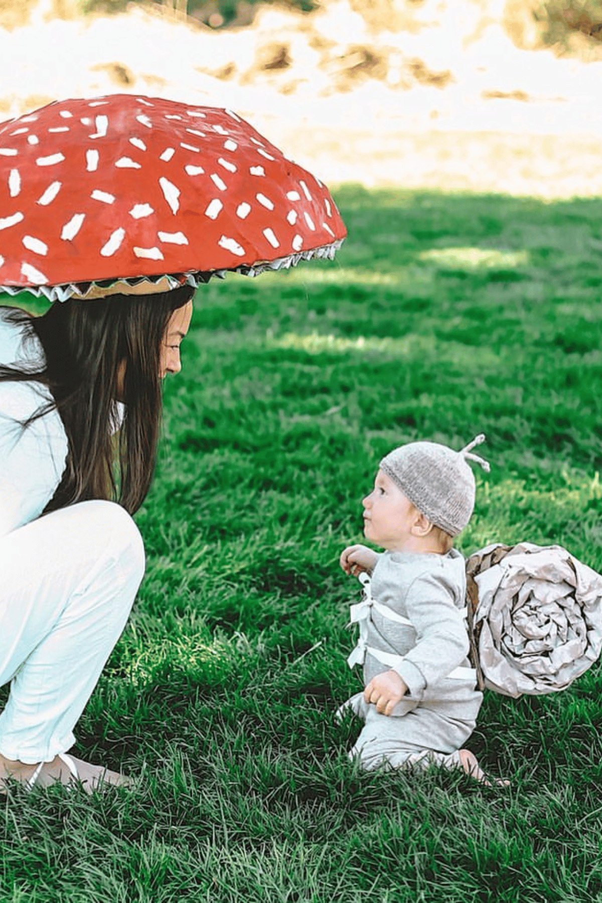 Mom dressed as a mushroom and baby as a snail