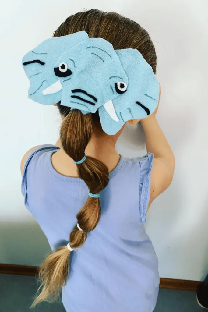 Elephant head made out of felt and ponytail trunk