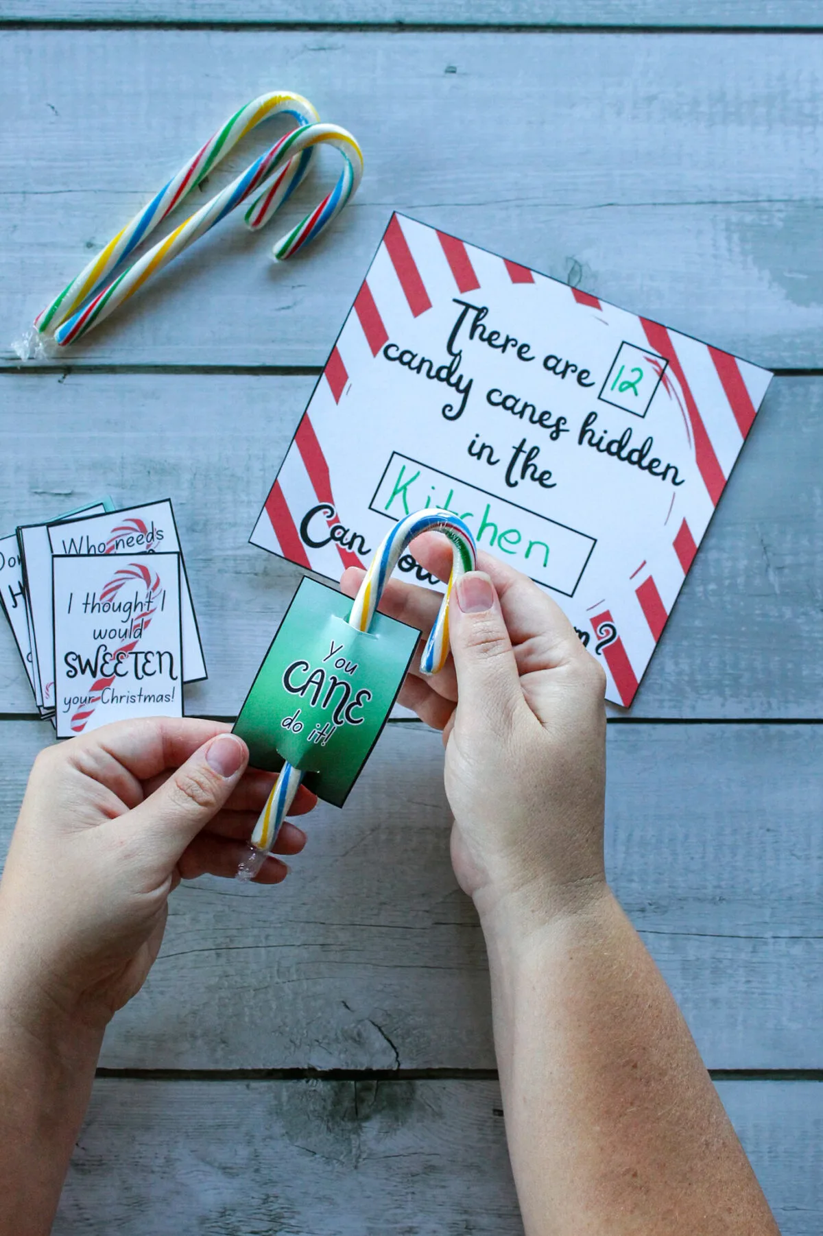 Mom attaching candy cane tags to candy canes