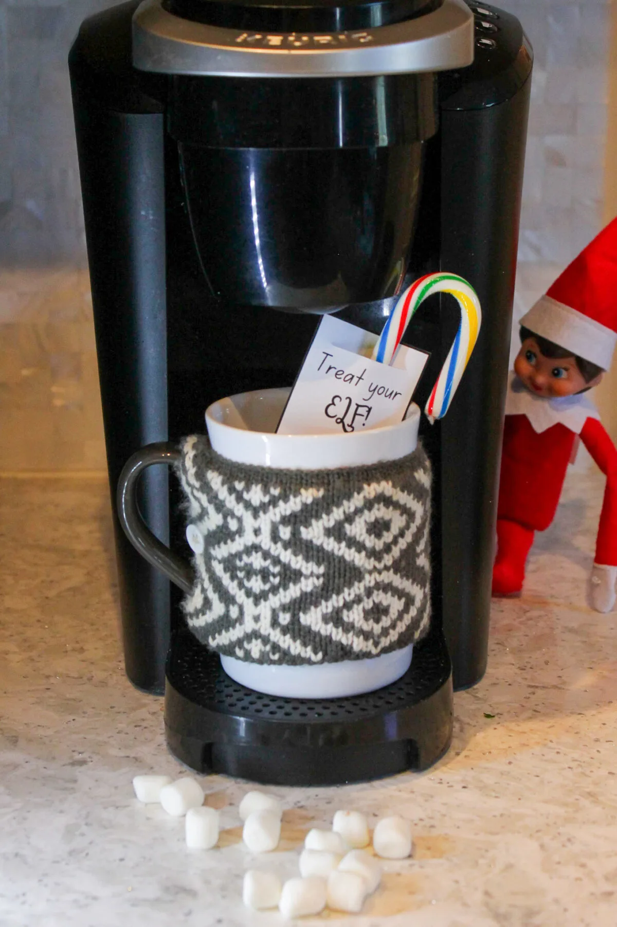 Elf hiding next to coffee maker