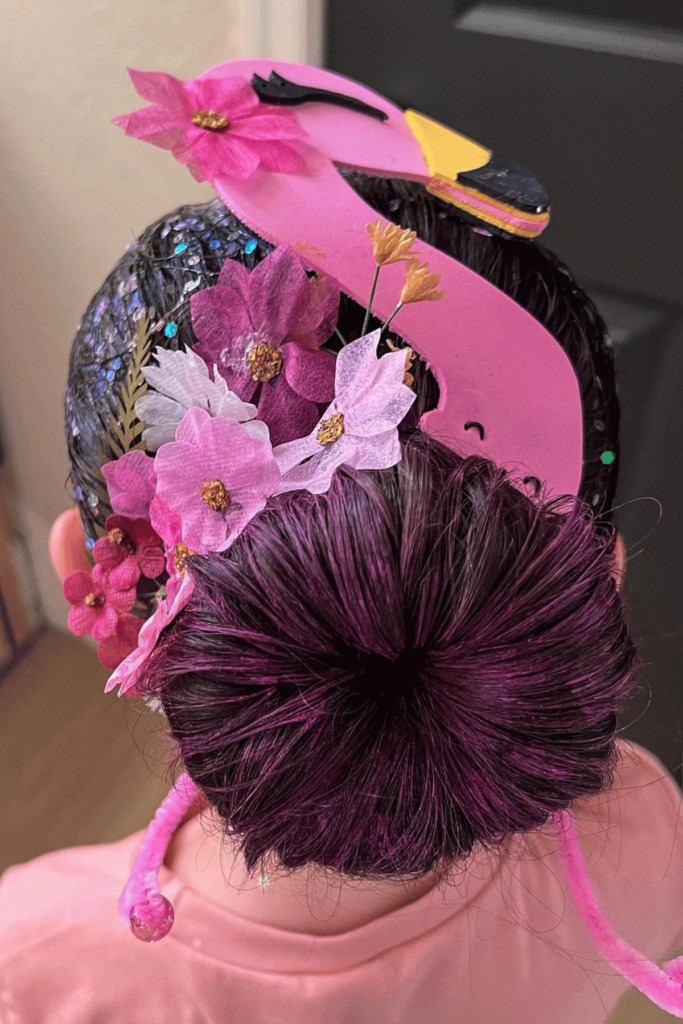 Bun with pink flowers and felt flamingo head