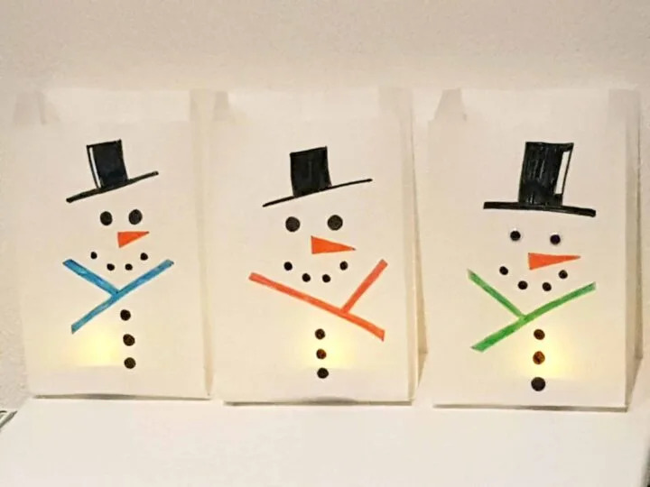 Snowman design on a white paper bag with light inside