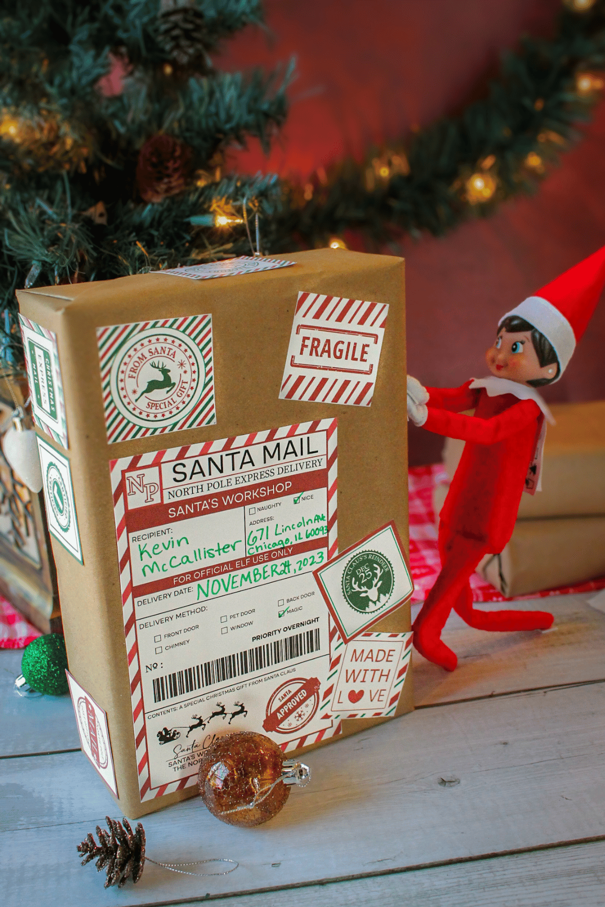 Elf on the Shelf pushing box into the house