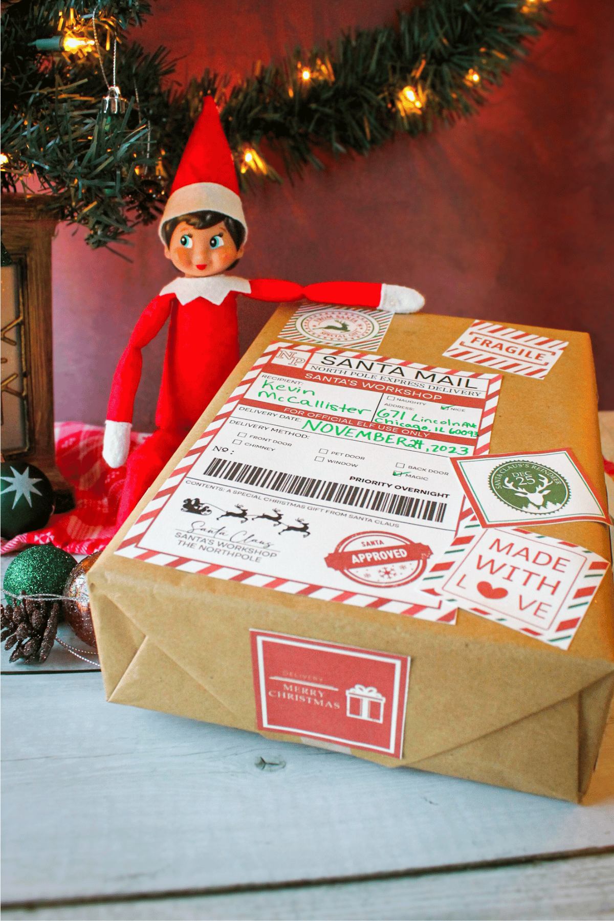 Elf bringing Santa mail box